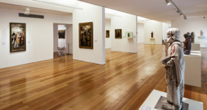 An Inclusive Checklist for Museums View of a clean, simple art museum gallery with paintings and sculpture.