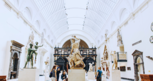 Sustainability in Museums: Where To Focus Your Efforts Museum visitors looking at an ancient marble sculpture.