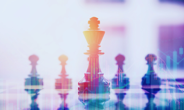 Chess pieces on a board with a lens flare effect.