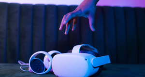 Let’s Talk About the Biggest Problems With AR and VR in Museums Hand reaching for a VR headset and touch controllers.