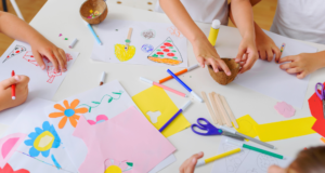 October 2 | Webinar: Disabilities Studies and Art Education: Reframing Student and Teacher Engagement Overhead view of a craft table with children making art