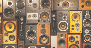 The Case for Digital Sound Enhancements in Exhibitions A wall of different audio speakers.