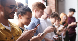 Community Engagement and Museum Advocacy: Tips for U.S. Museums From OMA A group of people standing in a line looking at their phones