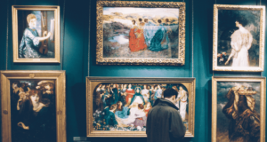 March 6 | Webinar: Reinstallation Roadmap: Evaluator Perspectives and Practices a person looking at paintings on display in an art museum