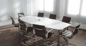April 3 | Webinar: Us vs. Them? Creating Healthy Board Relationships An empty conference room