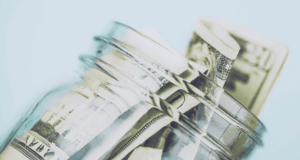 June 10 | Webinar: Building Stable Resources in Tough Economic Times A glass jar with cash in it