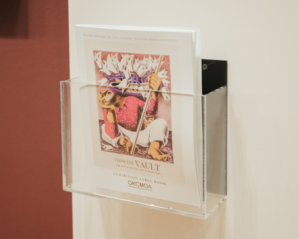 Label book in wall-mounted holder at OKCMOA From the vault exhibition