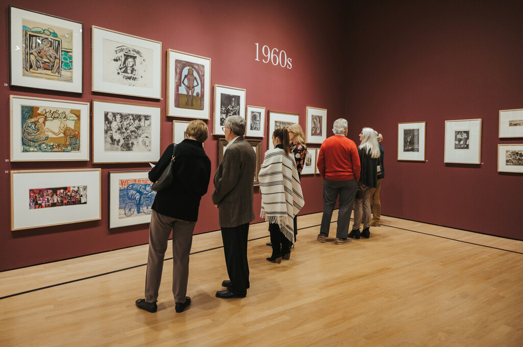 Visitors viewing artworks at OKCMOA From the Vault exhibition