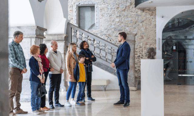 museum educator support group of people on a museum tour