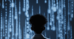 September 25 – 26: Digital Collections Summit Person in White Shirt Standing in Front of Cascading Blue Lights