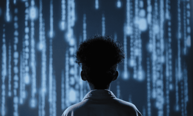 Person in White Shirt Standing in Front of Cascading Blue Lights