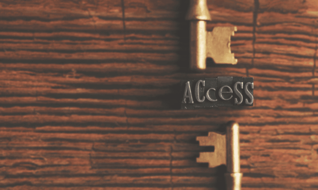 two keys on a table with the word "access" in between them