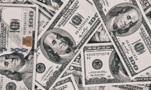 pile of hundred dollar bills