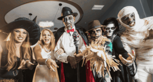 Discover Creative Halloween Programming at Museums in 2025 A group of adults in Halloween costumes
