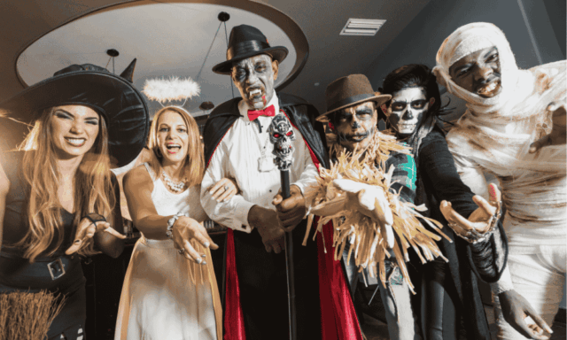 A group of adults in Halloween costumes