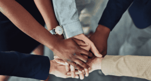 November 17 | Developing Cohesive Teams Stacked hands to show teamwork