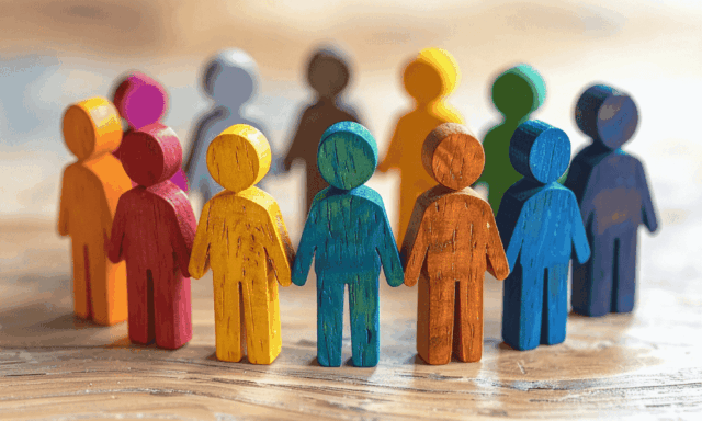 Colorful wooden people arranged in a circle