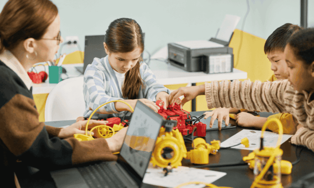 Children working on STEM projects at a table