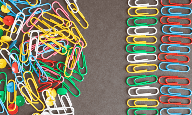 a messy pile of paper clips next to ordered rows of paper clips